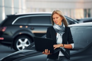 Young businesswoman with the laptop.